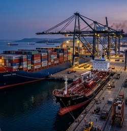 Container ship and chemical tanker berthed at port facility